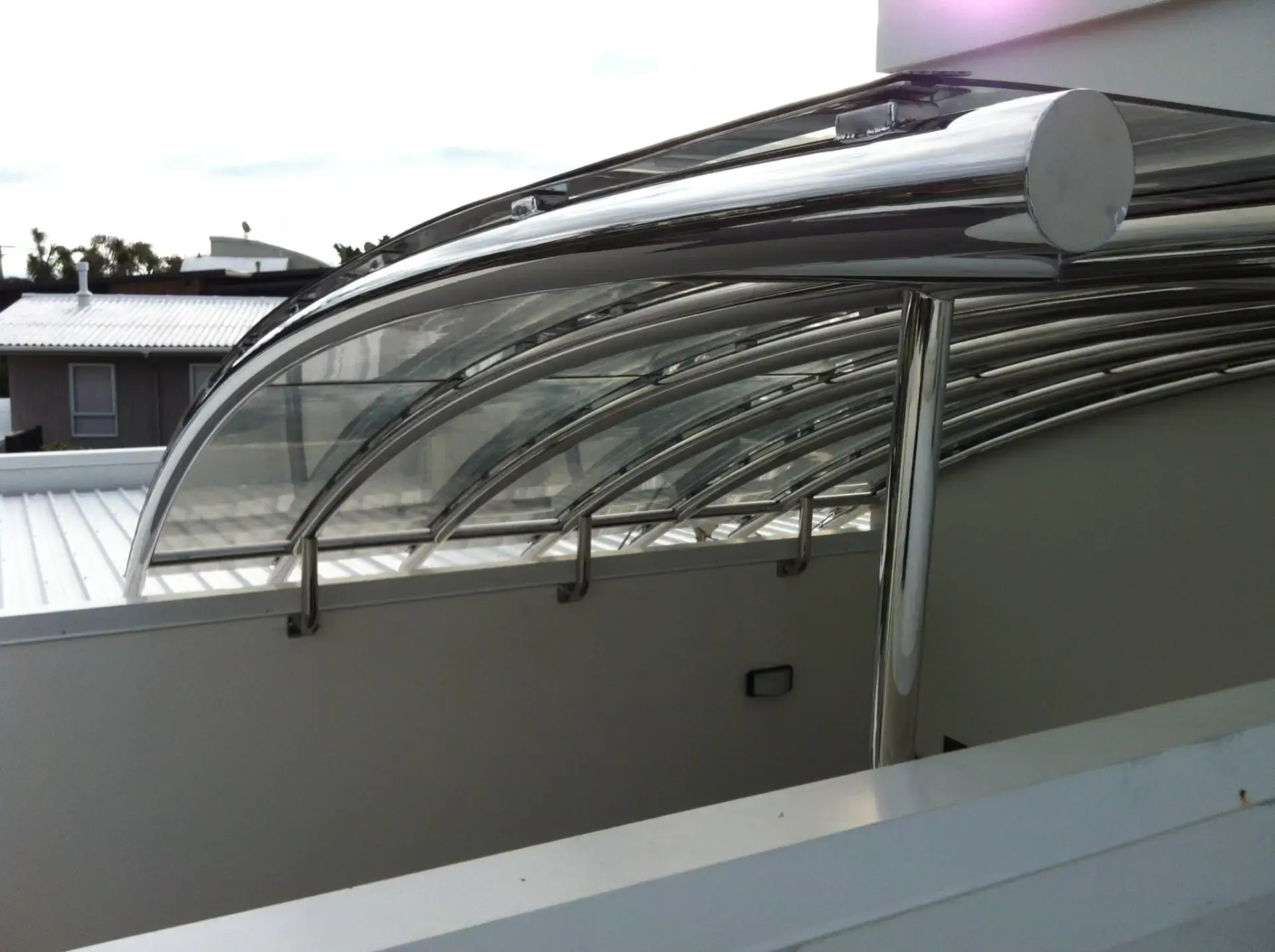 Curved stainless steel boat canopy with polycarbonate panels