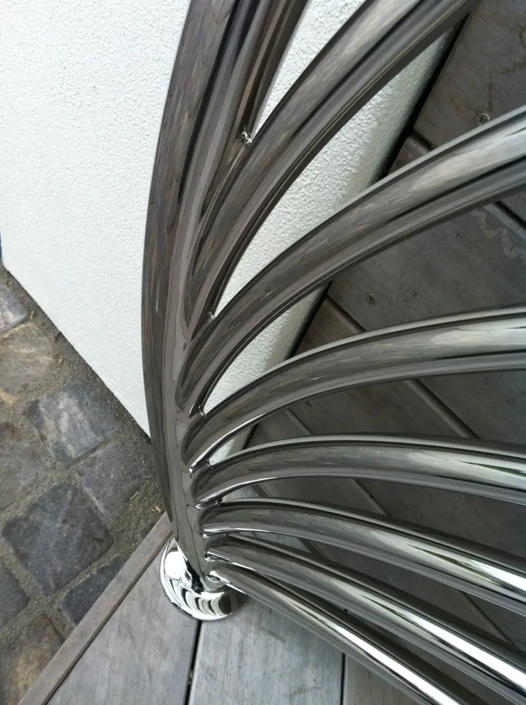 Curved stainless steel railing with multiple horizontal bars