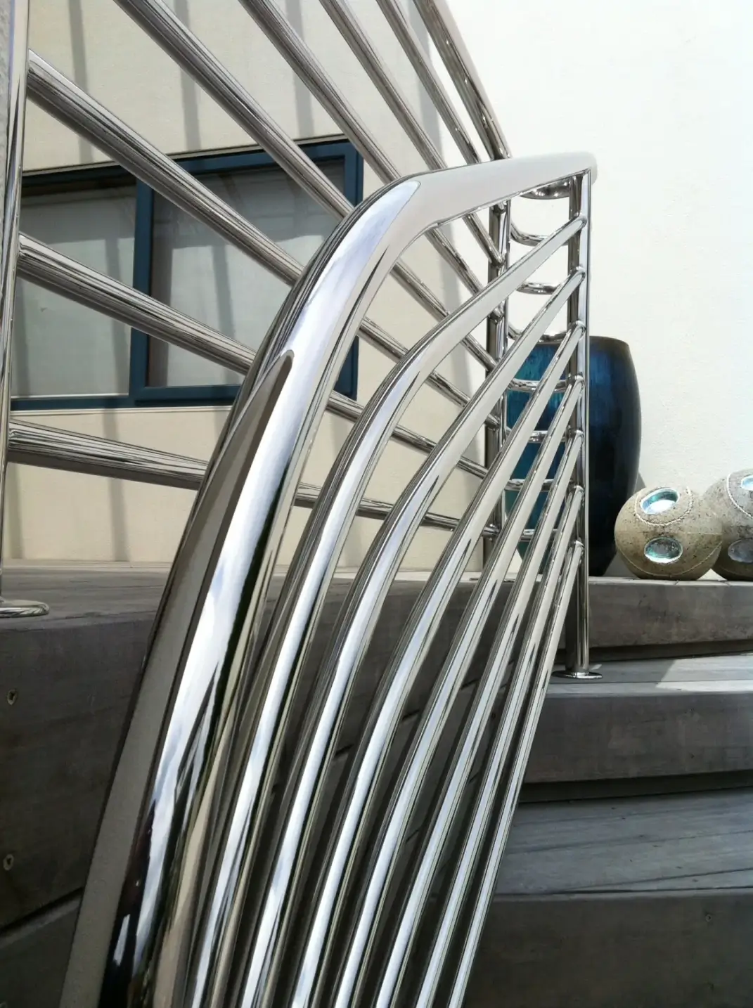 Art deco inspired curved stainless steel balustrade