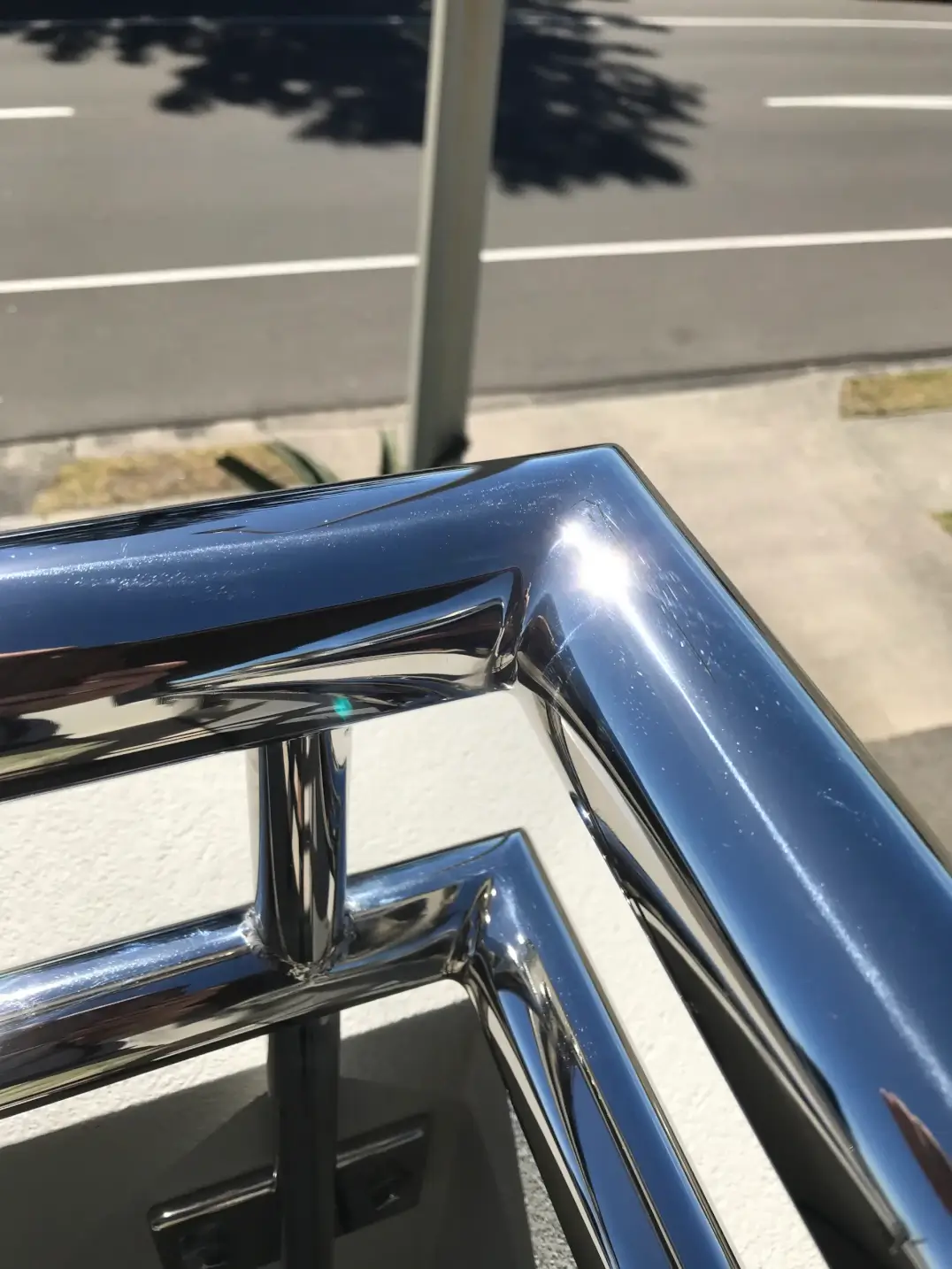 Polished stainless steel handrail welded corner joint