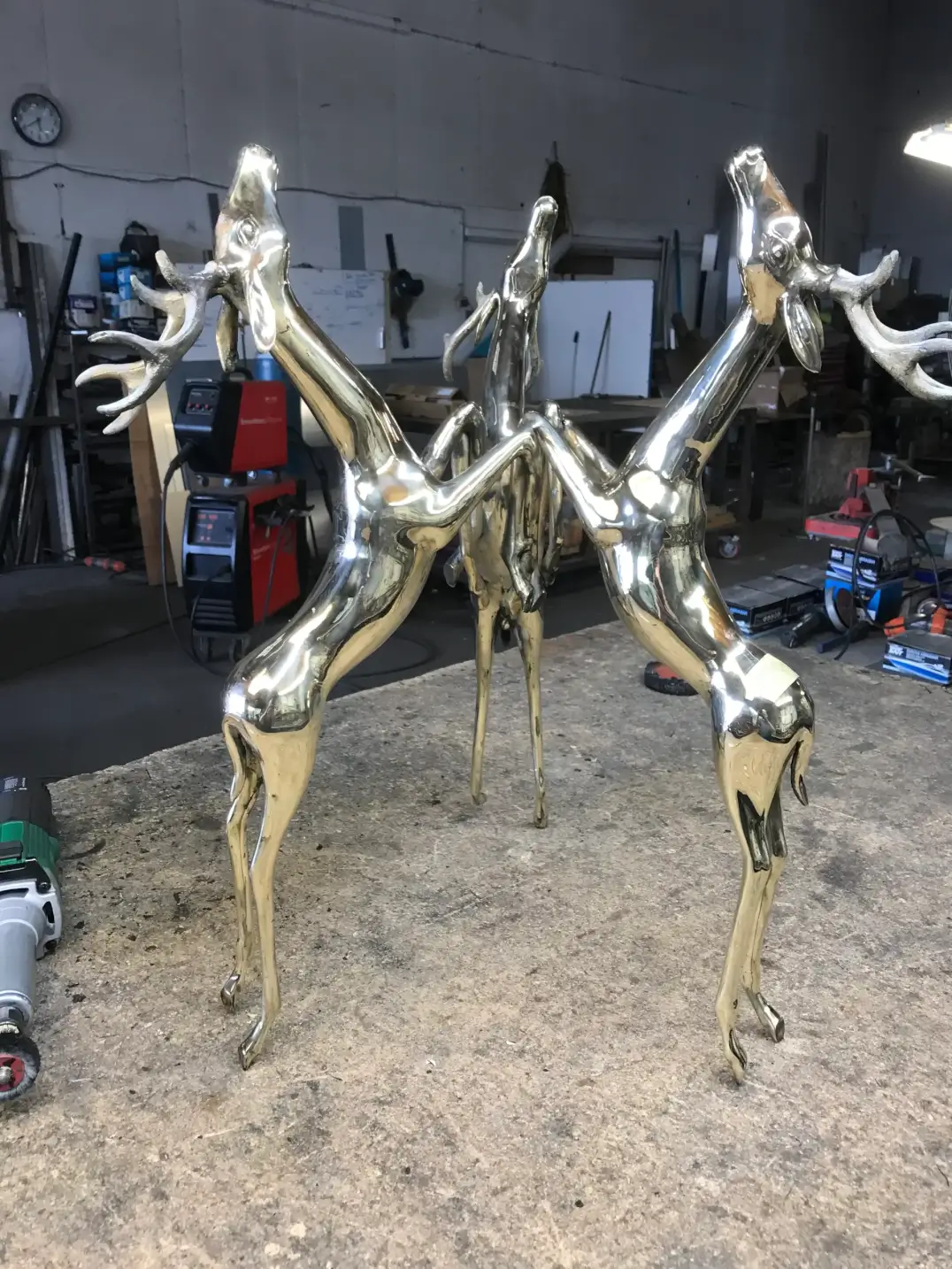 Polished stainless steel horse sculpture art installation