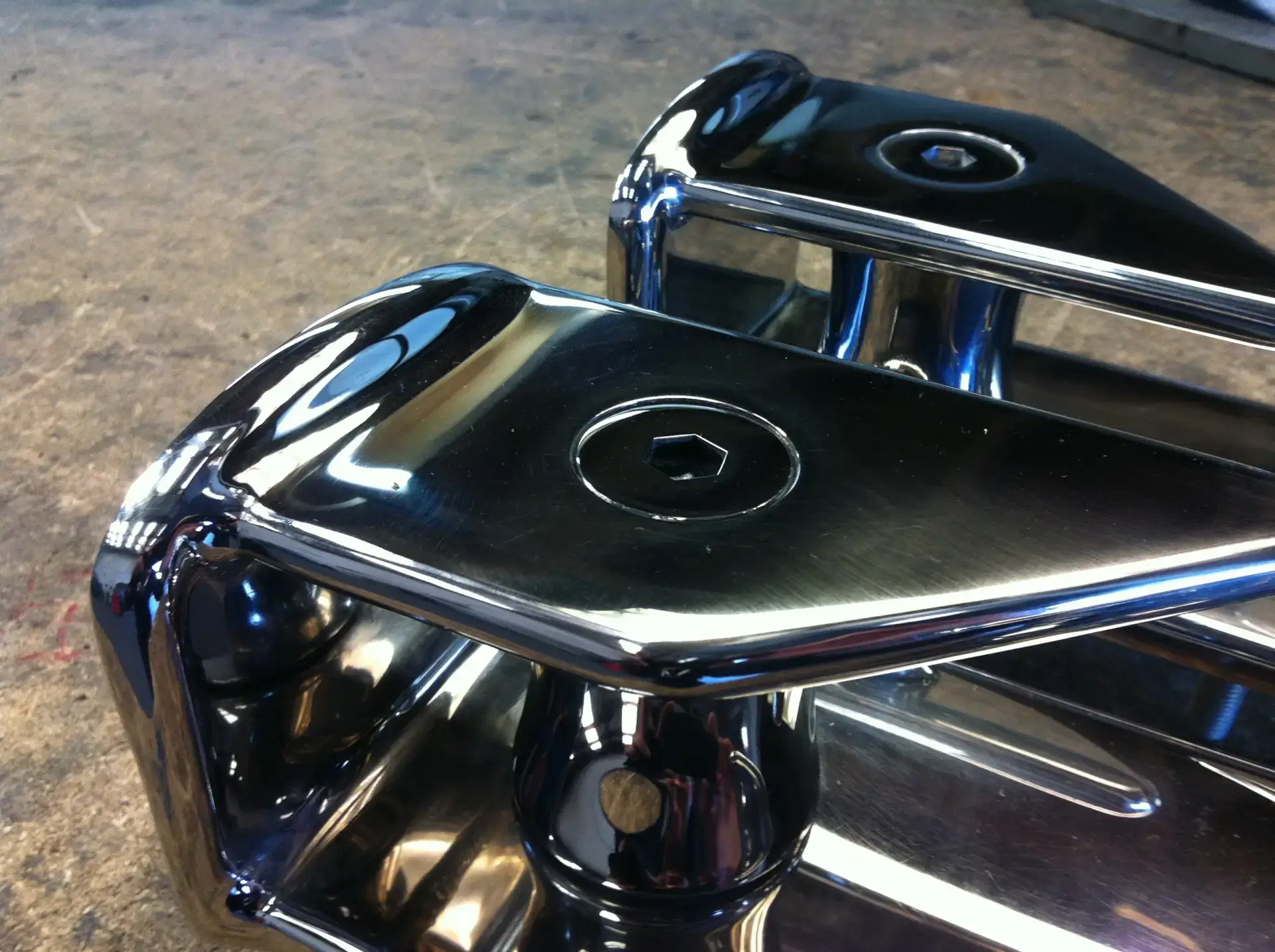 Close-up polished chrome marine cleat detail