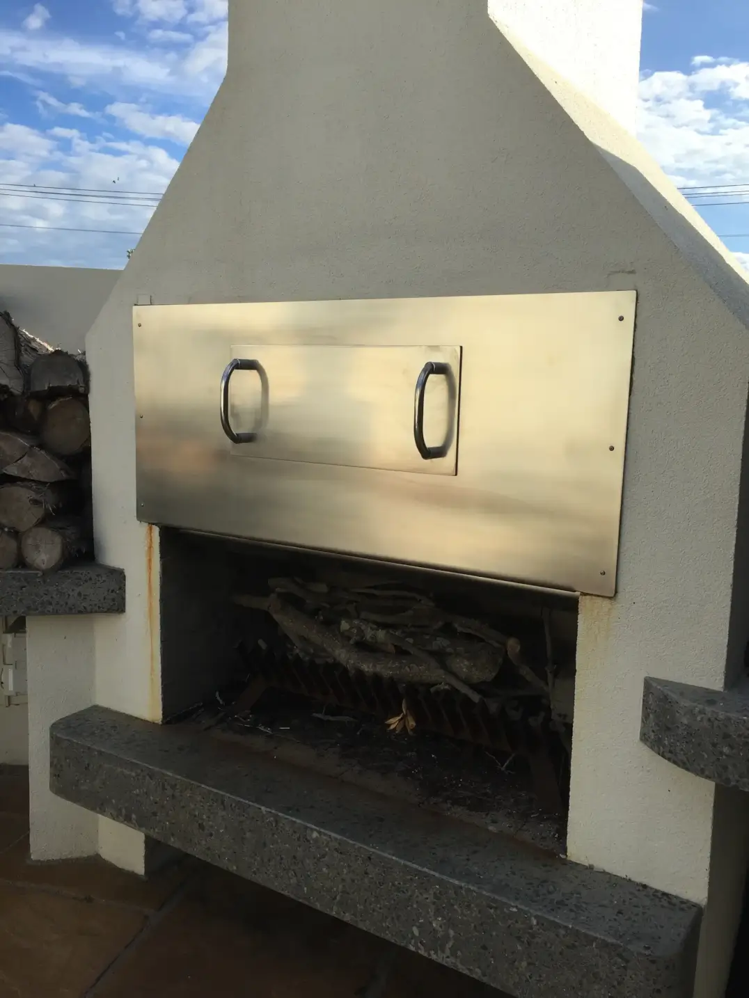 Stainless steel outdoor fireplace door with handles
