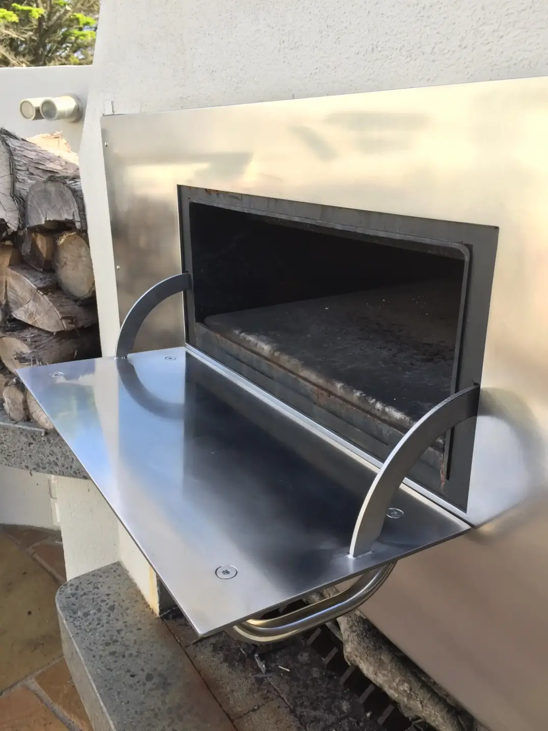 Stainless steel outdoor fireplace insert with sliding door