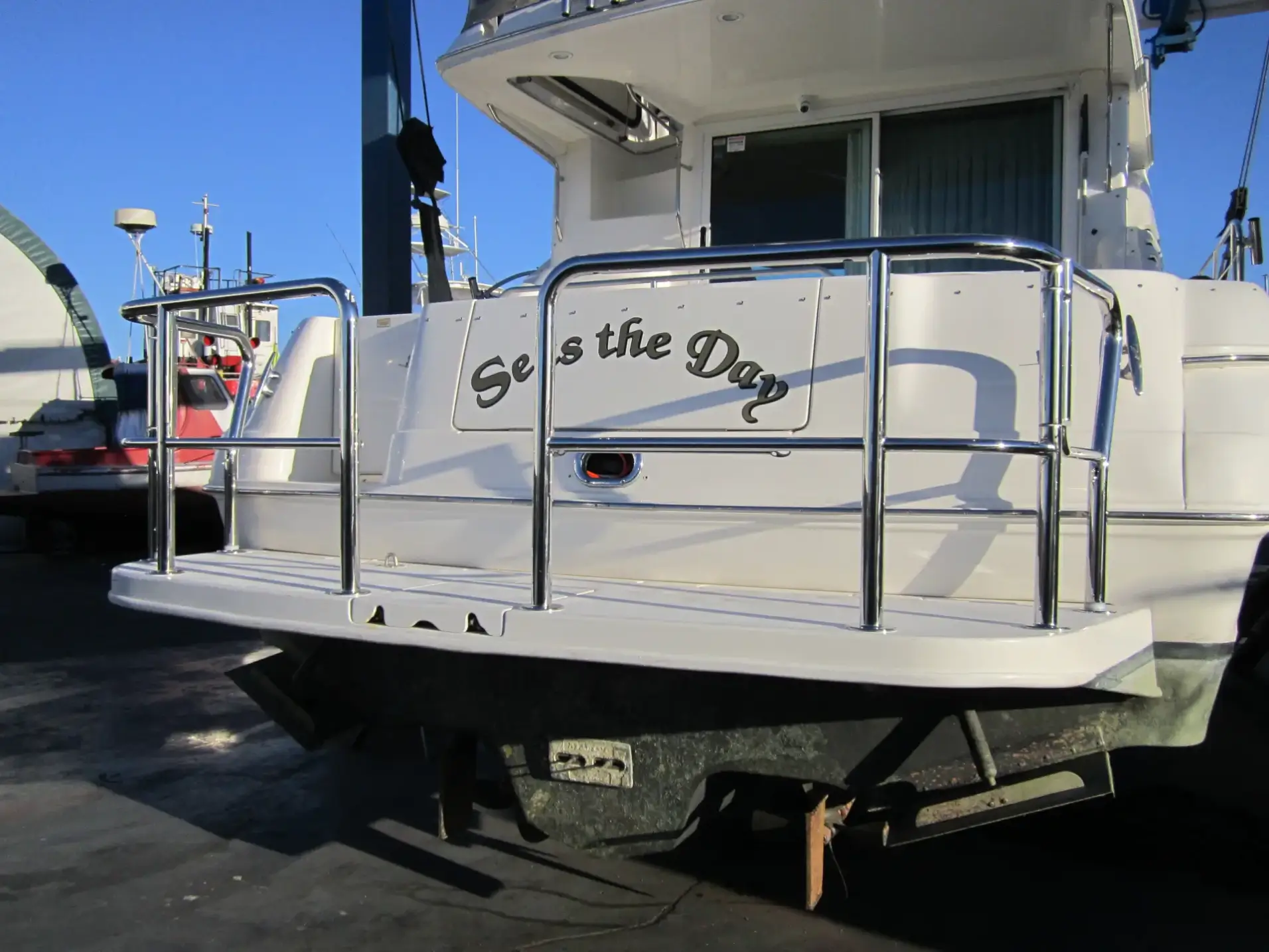 Polished stainless steel boat stern rail and gate