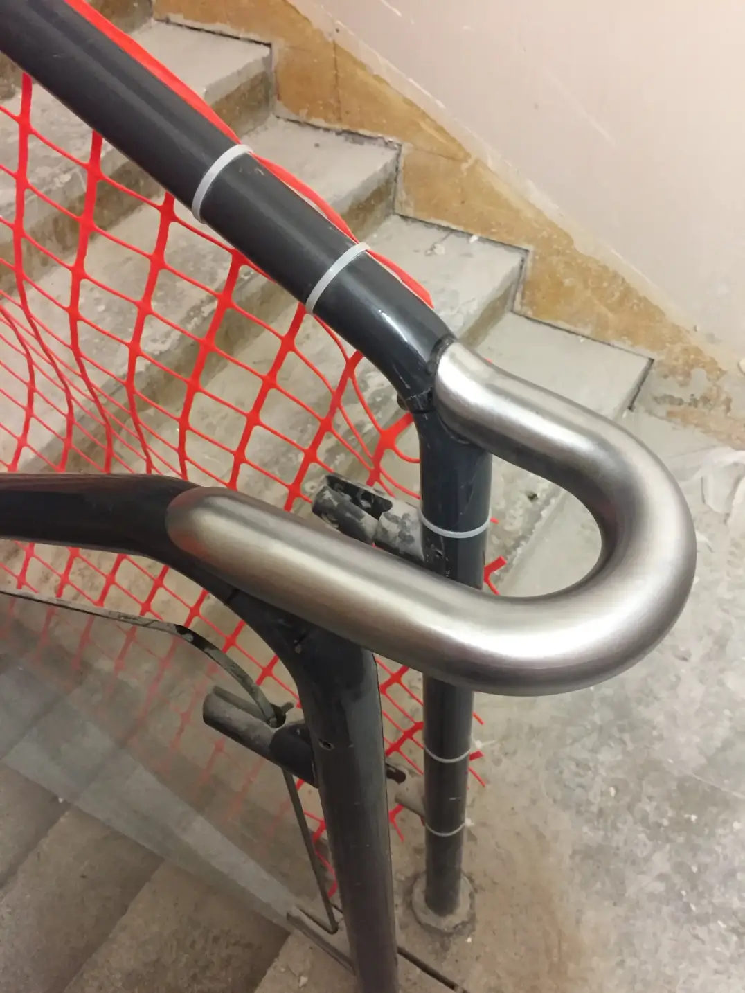 Powder coated steel handrail with stainless connector detail