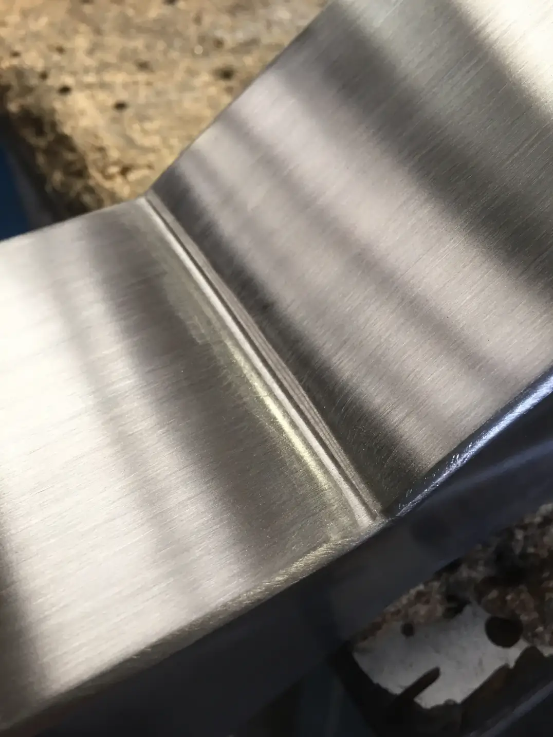 Brushed stainless steel precision welded corner joint