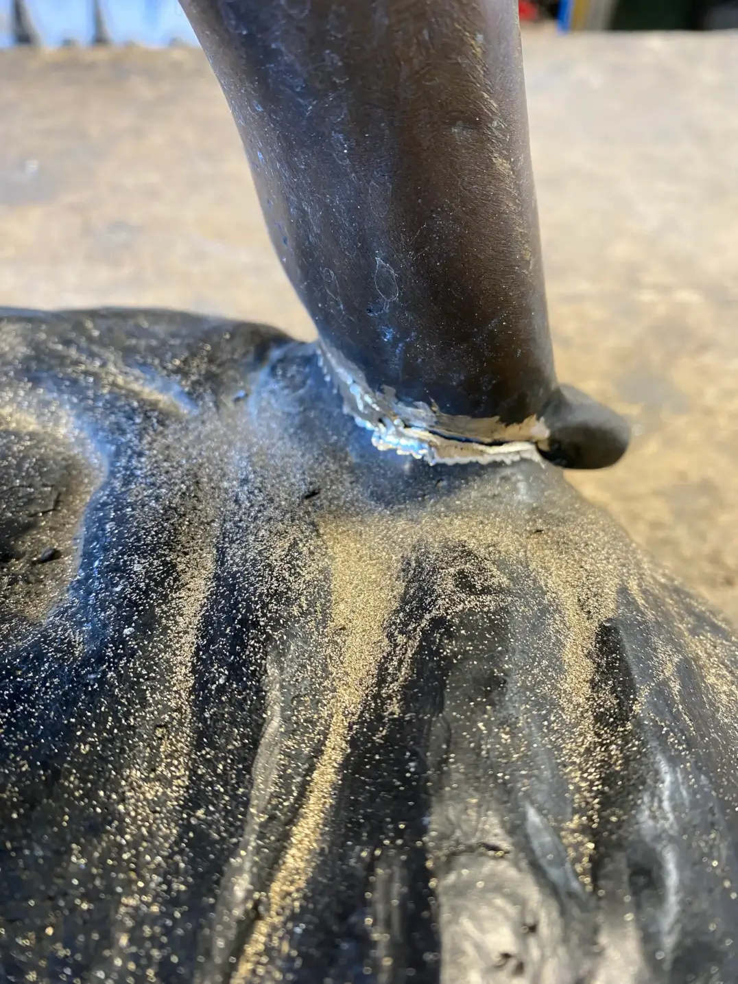 Close-up stainless steel sculpture weld detail